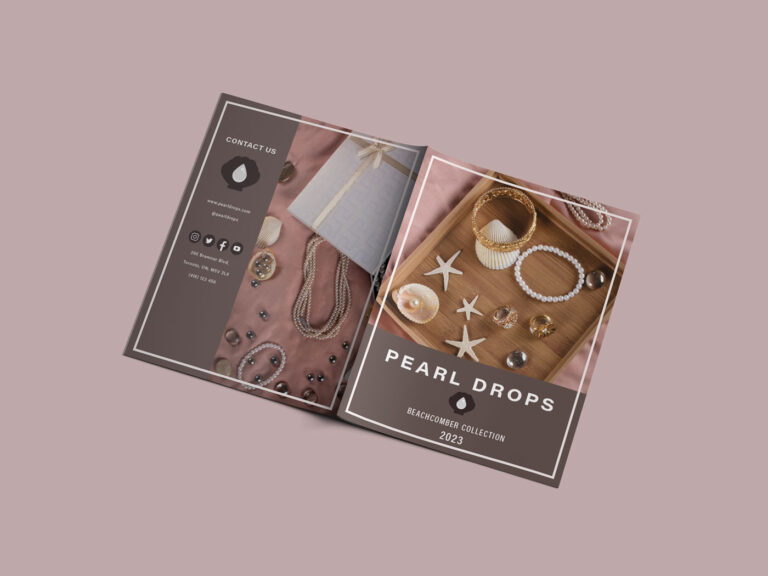 Front and back cover of a lookbook placed down showing pearl jewelry on a dark mauve background.